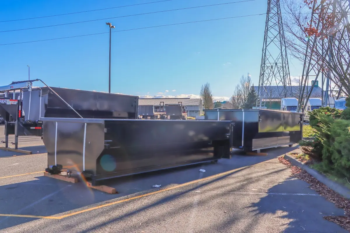 Roll-off dumpster ready for waste disposal at job site for 2 Yard Dumpster Rental in Picnic Point